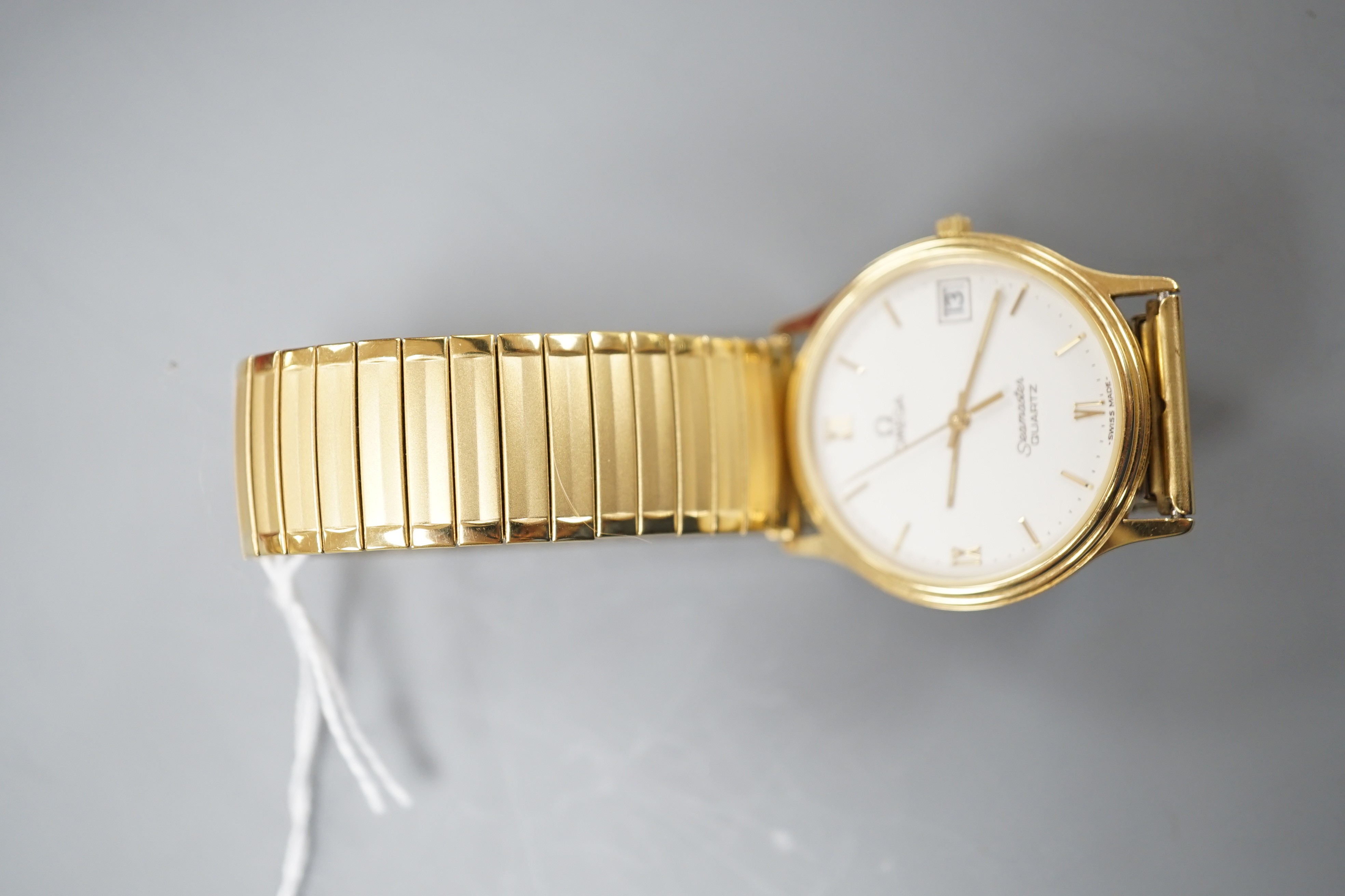 A gentleman's steel and gold plated Omega Seamaster quartz wrist watch, on associated flexible strap, with Omega box.